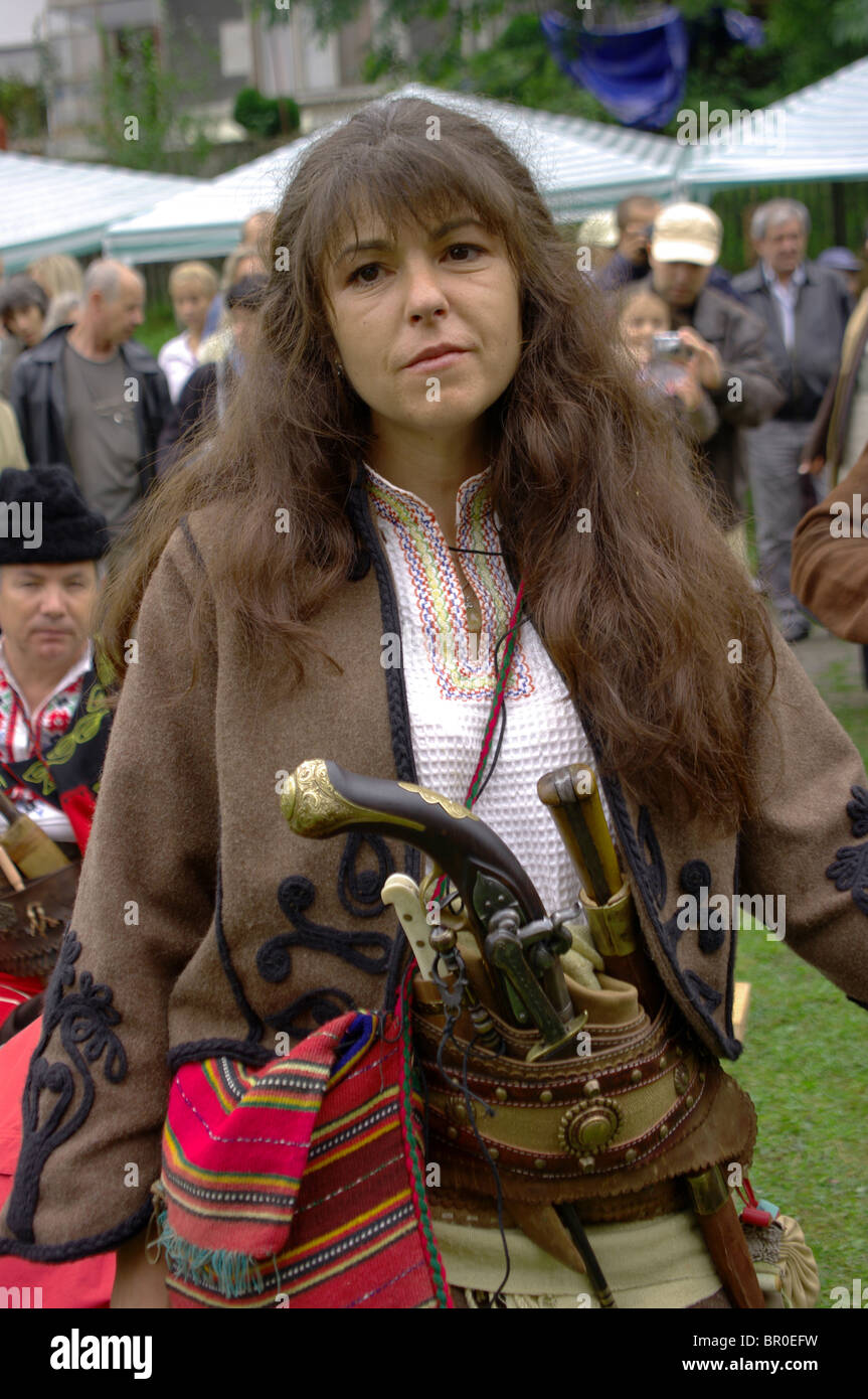 Woman with arms and clothes of 17-18 century in Bulgaria Stock Photo