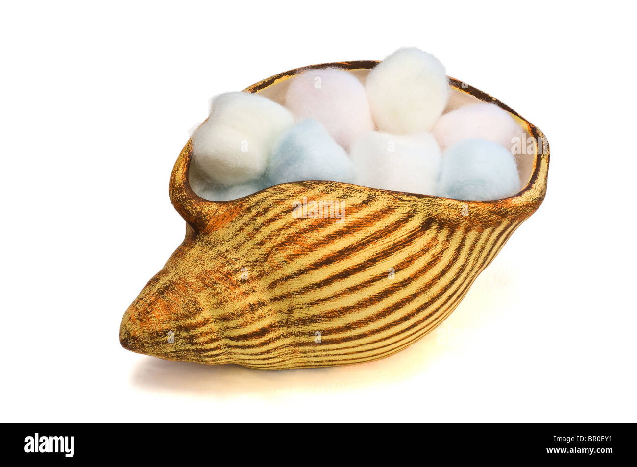 Periwinkle filled with colored cotton balls Stock Photo Alamy