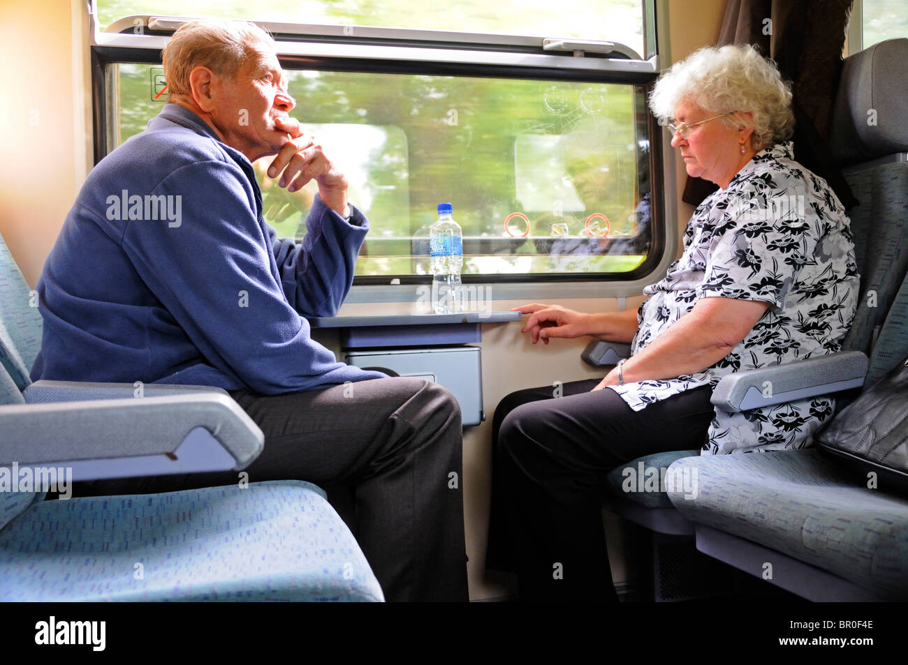 Hungary. Old couple on a train Stock Photo