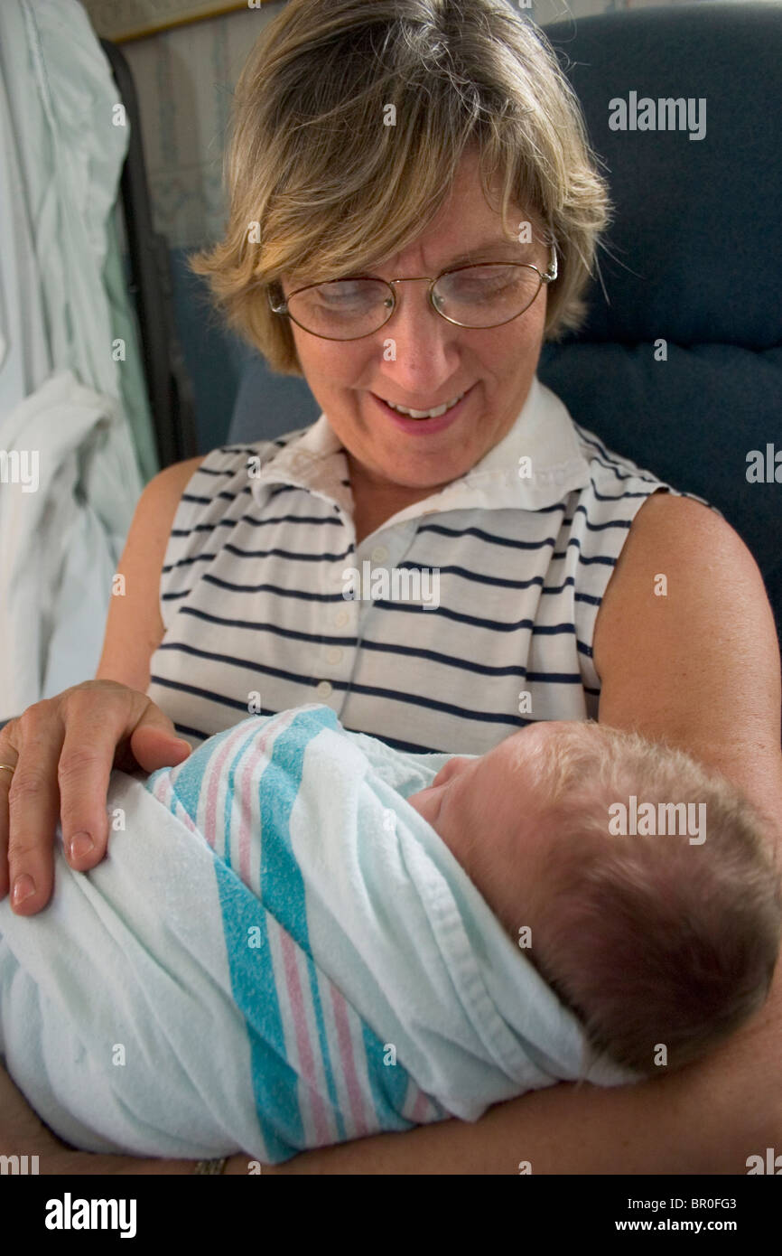 Grandmother holding a newborn baby in the hospital Stock Photo - Alamy