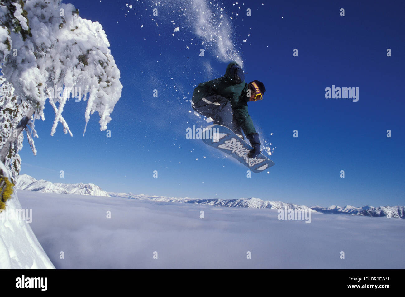 Young male snowboarder catches big air over the clouds at Fernie Alpine  Resort, Fernie, BC, Canada Stock Photo - Alamy