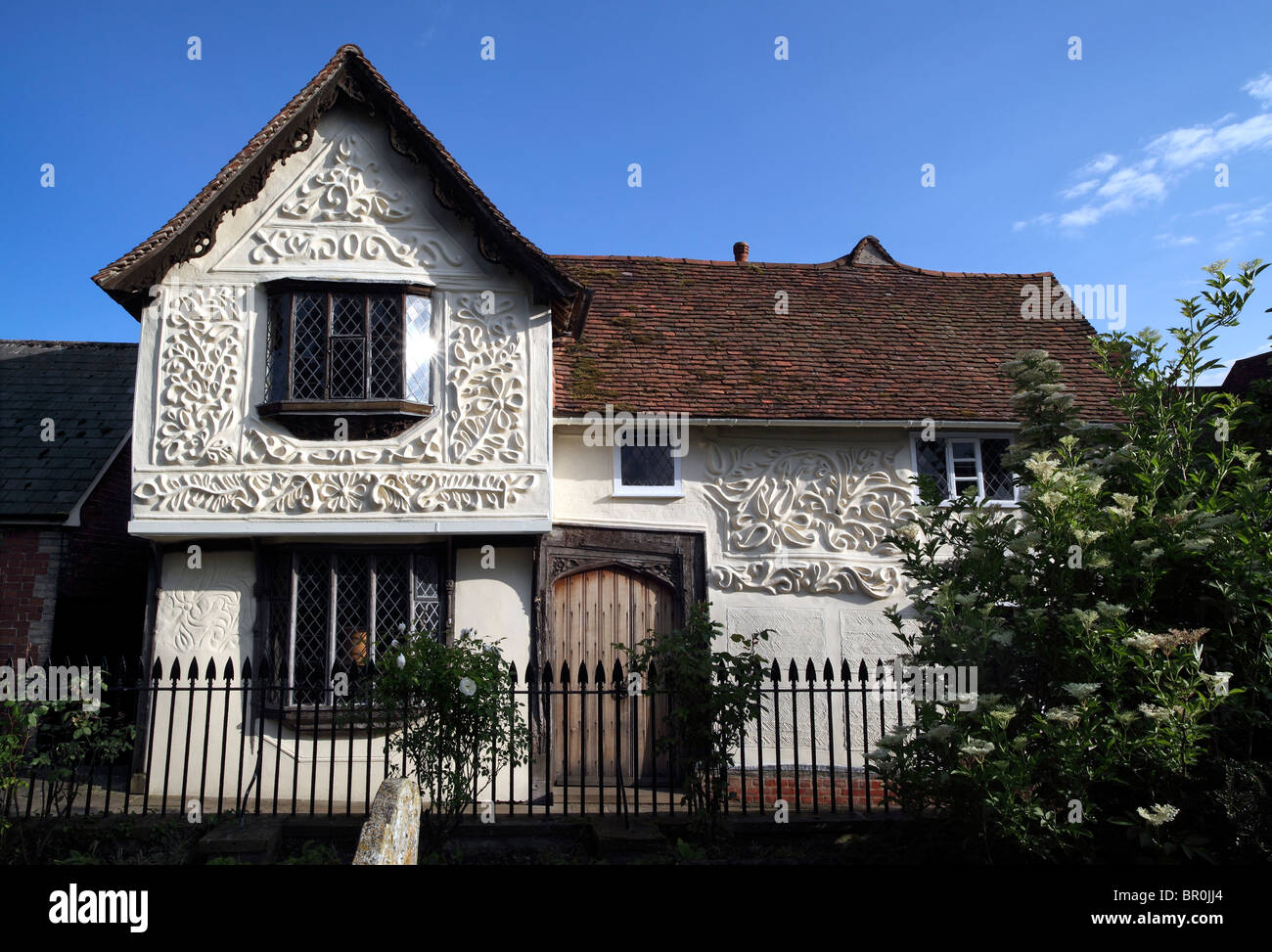 Midsummer evening sunlight highlights pargetting on the restored Ancient House, Clare, Suffolk. Stock Photo