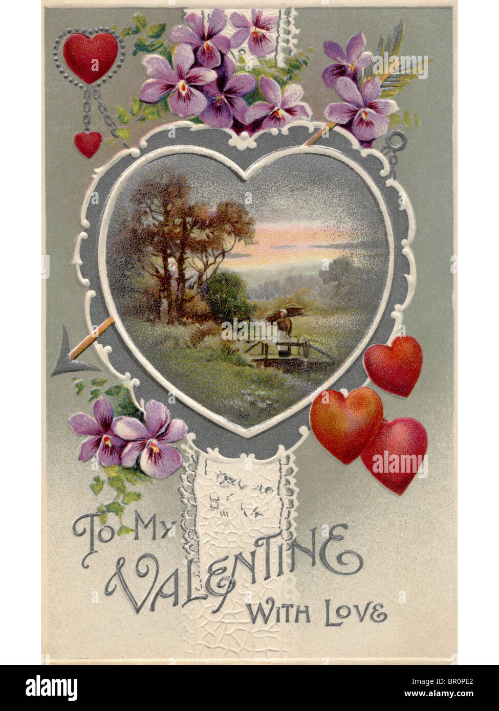 A vintage Valentines card with an idyllic country scene,hearts and violets Stock Photo
