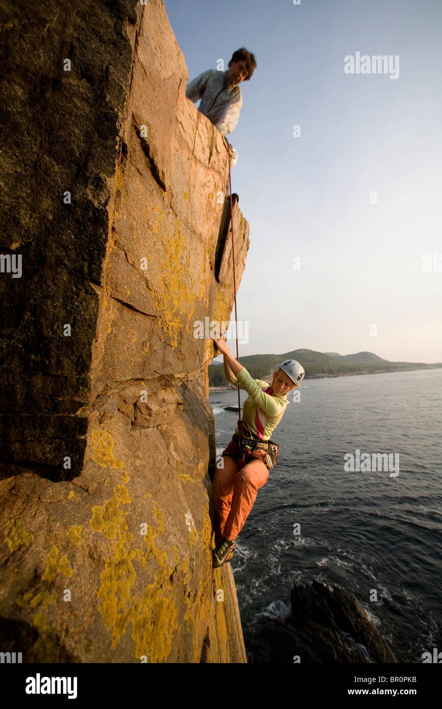 Rock Climbing on oceanside cliffs, Maine Stock Photo Alamy