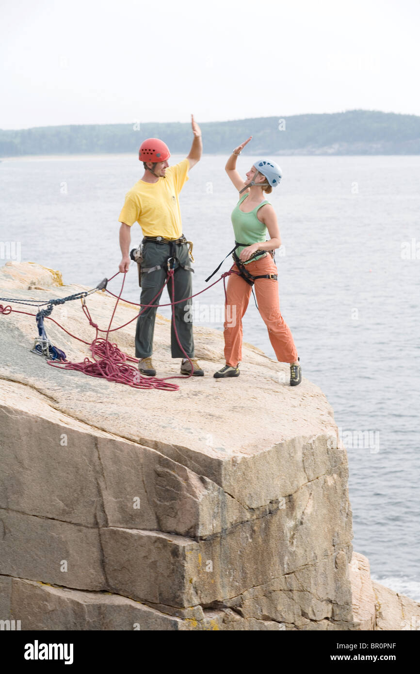 Rock Climbing on oceanside cliffs, Maine Stock Photo Alamy