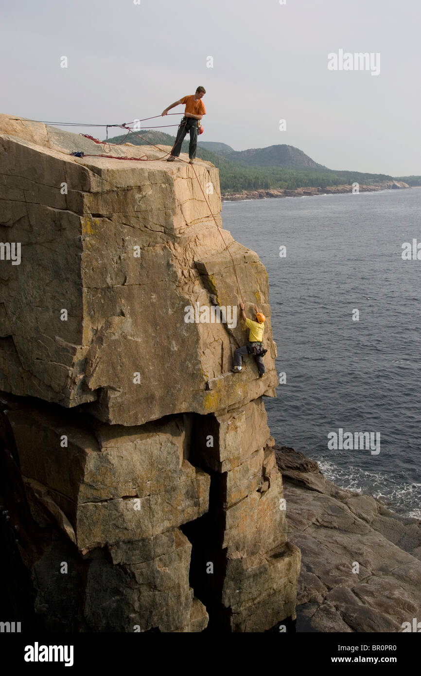 Rock Climbing on oceanside cliffs, Maine Stock Photo Alamy