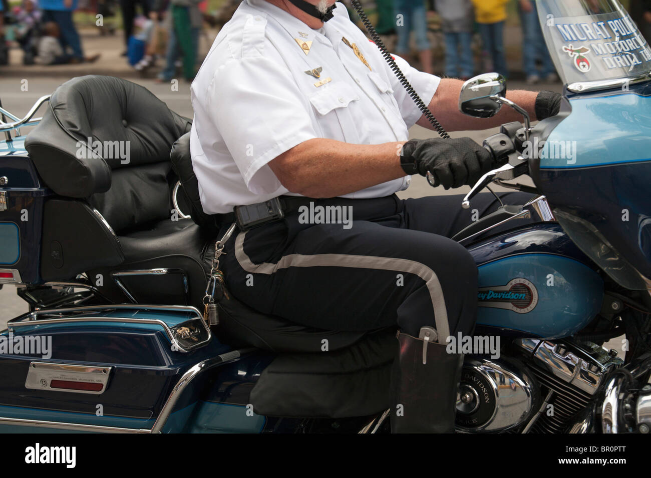 Indianapolis, Indiana - An obese man rides a motorcycle in the Labor Day parade. Stock Photo