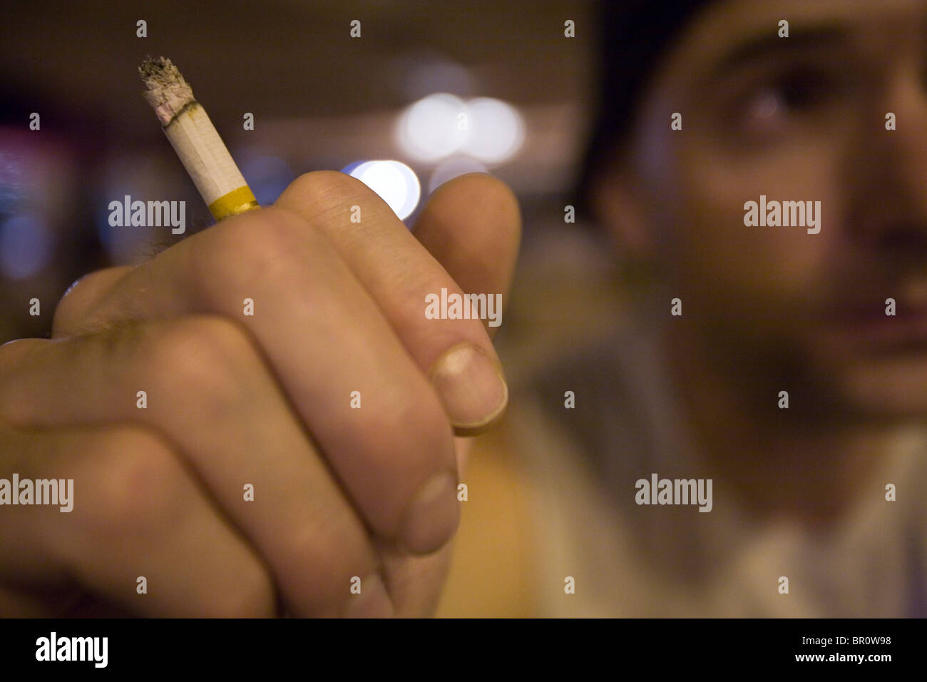 smoking half burnt cigarettes Hand holding half cigarette hi-res stock photography and images