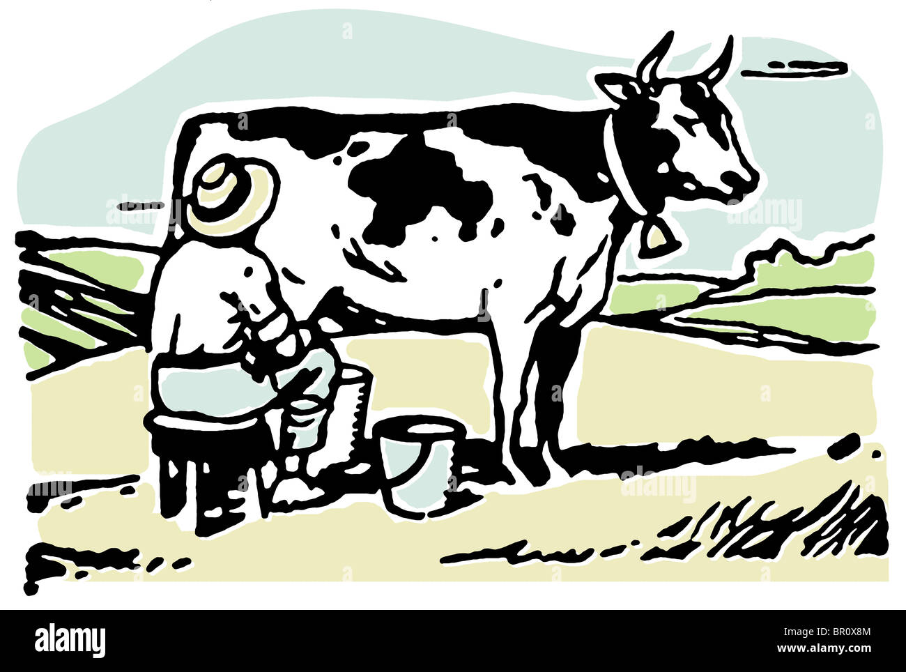 A man milking a cow in a field Stock Photo