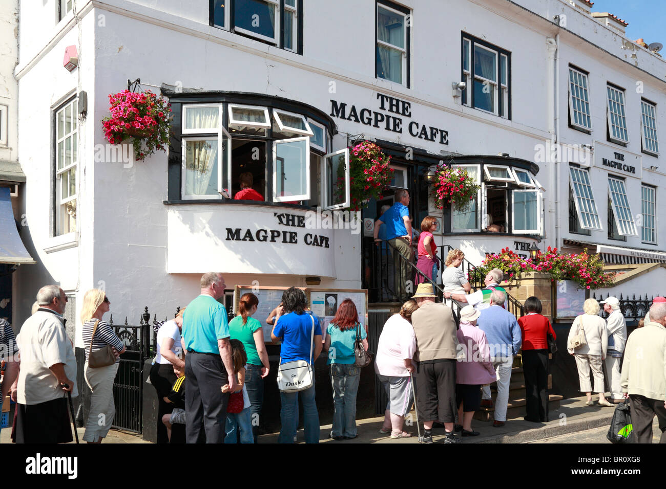 Diners queuing outside The Magpie Cafe restaurant, Whitby, North