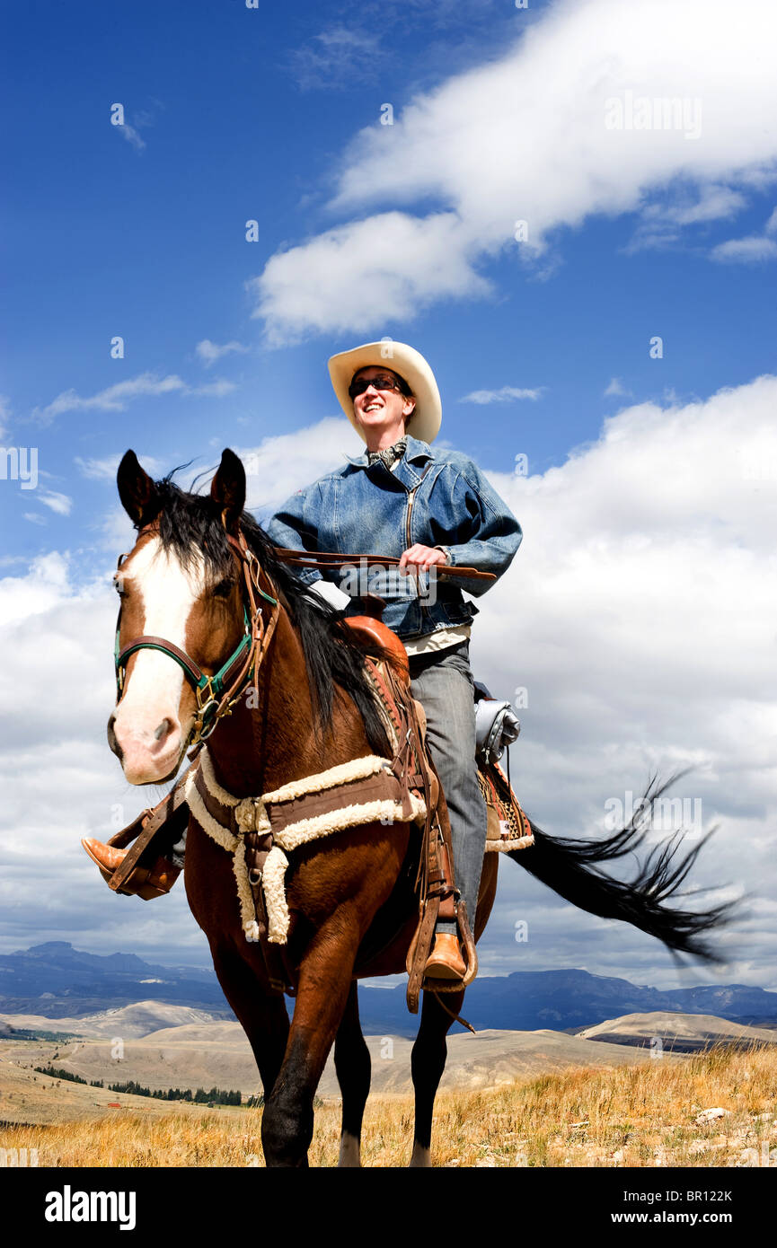 Cowgirl riding a horse in Wyoming. Western style Stock Photo