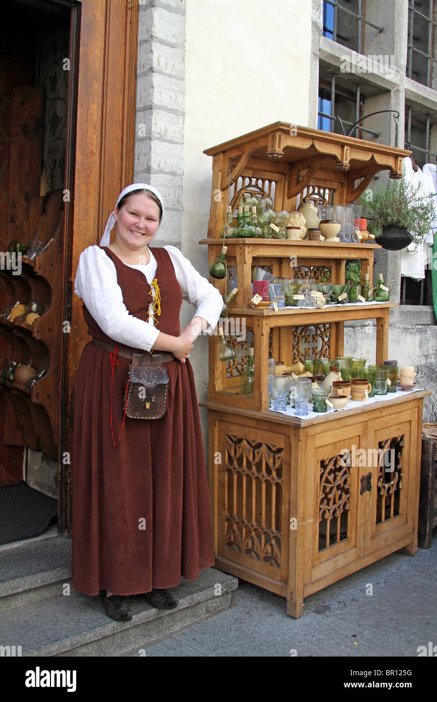 Woman shopkeeper dressed in traditional costume in Tallinn, Estonia Stock Photo