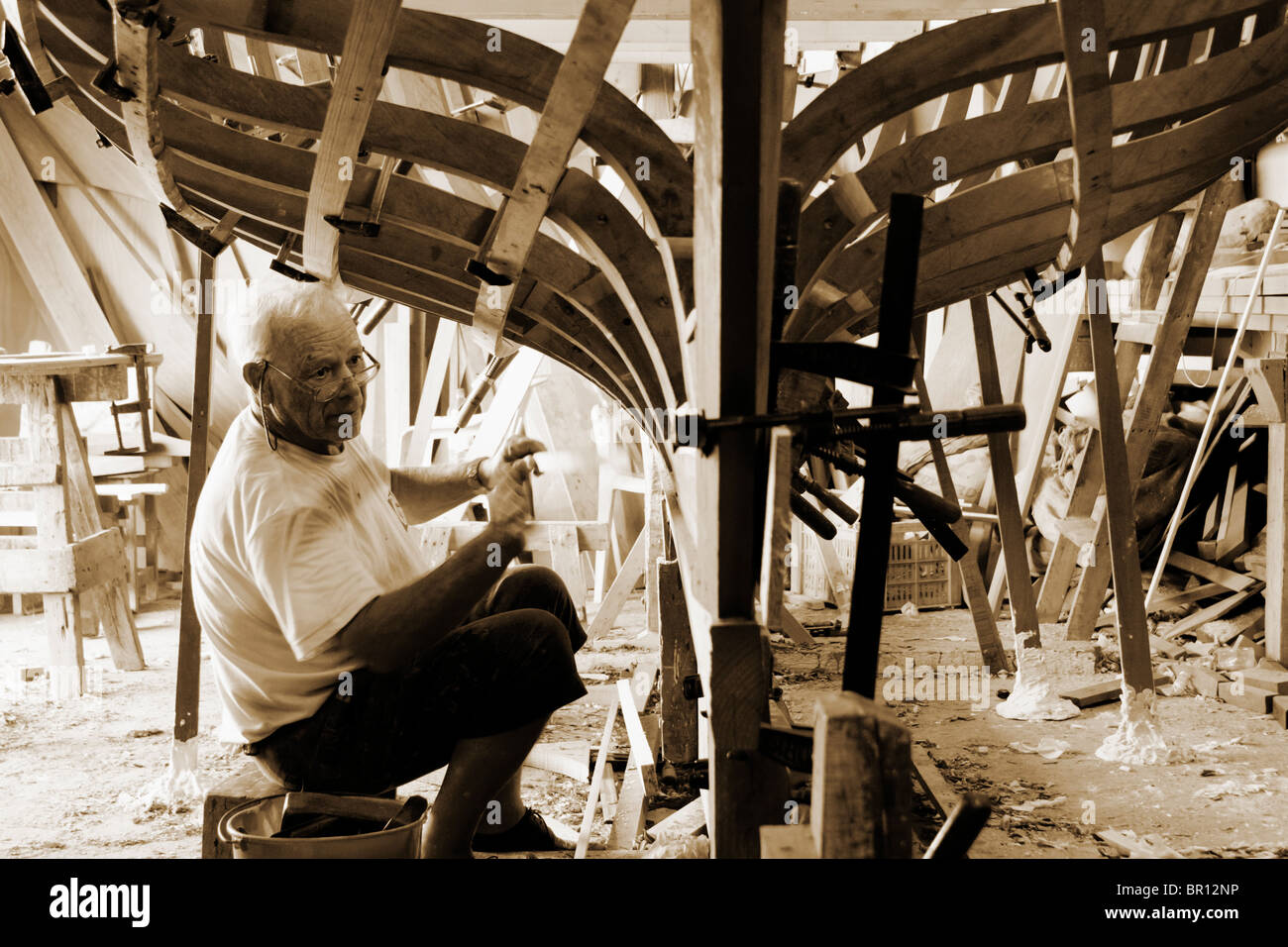 Boat builder working on Vela Latina class boat on Gran Canaria Stock Photo