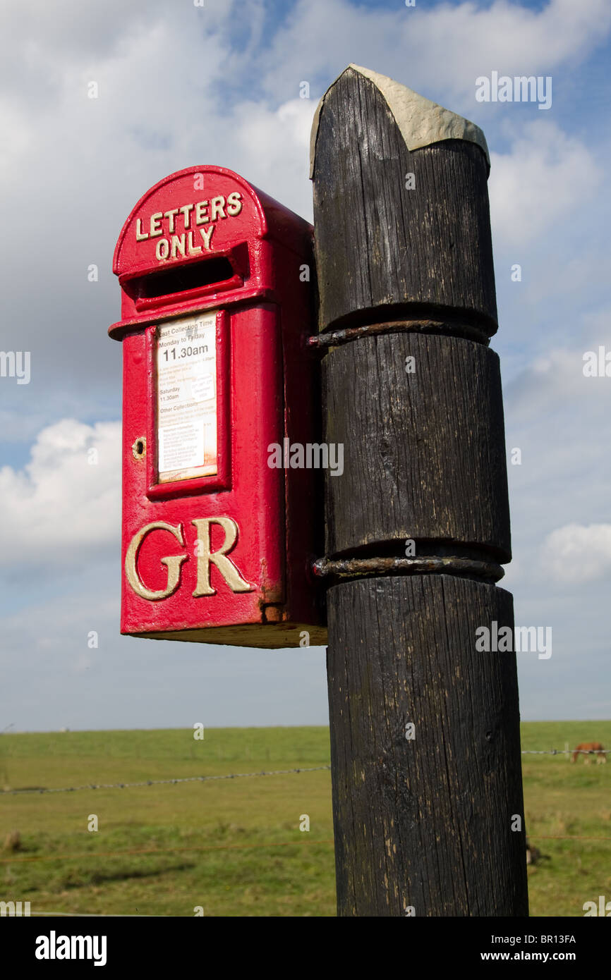 Royal Mail GR George's reign King George VI, Red Letter Box on a wooden post, Cruden Bay, Aberdeenshire, Scotland, UK Stock Photo