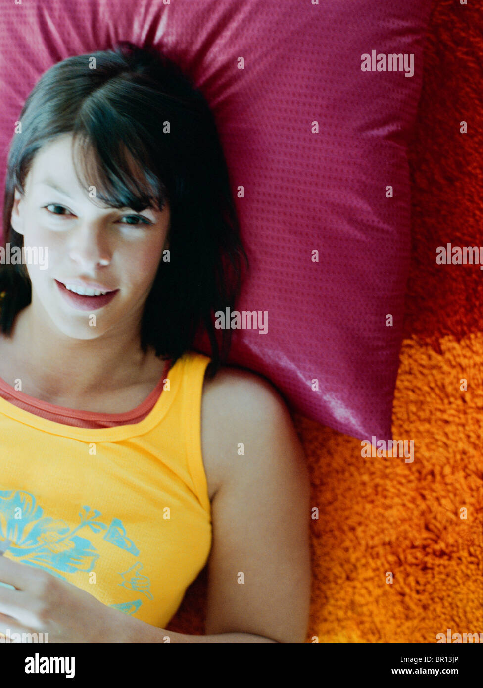 Woman laying on pillow on floor Stock Photo Alamy