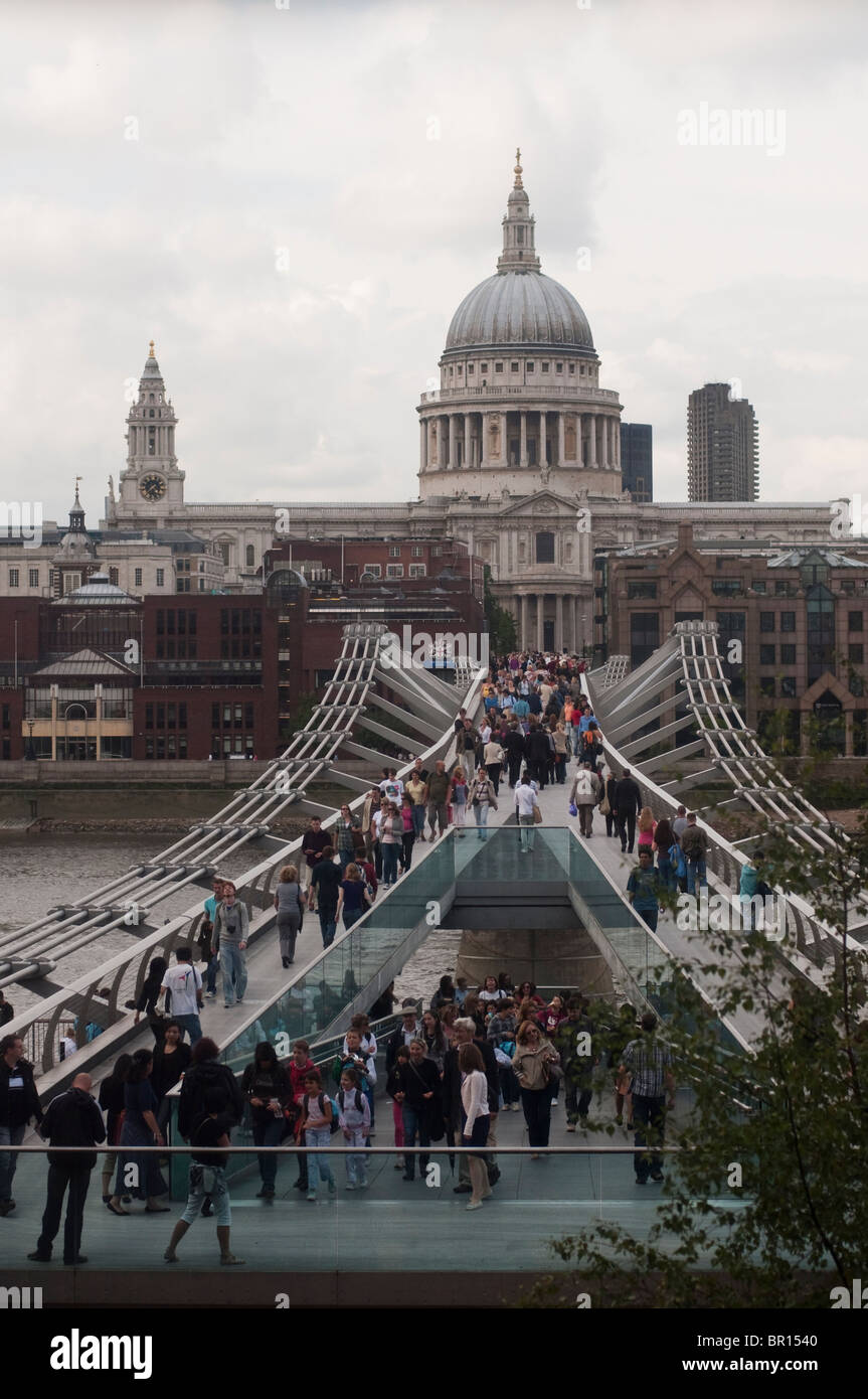 St. Paul's Cathedral and the Millennium Bridge as seen from the Tate Modern in London, England in Summer. Stock Photo