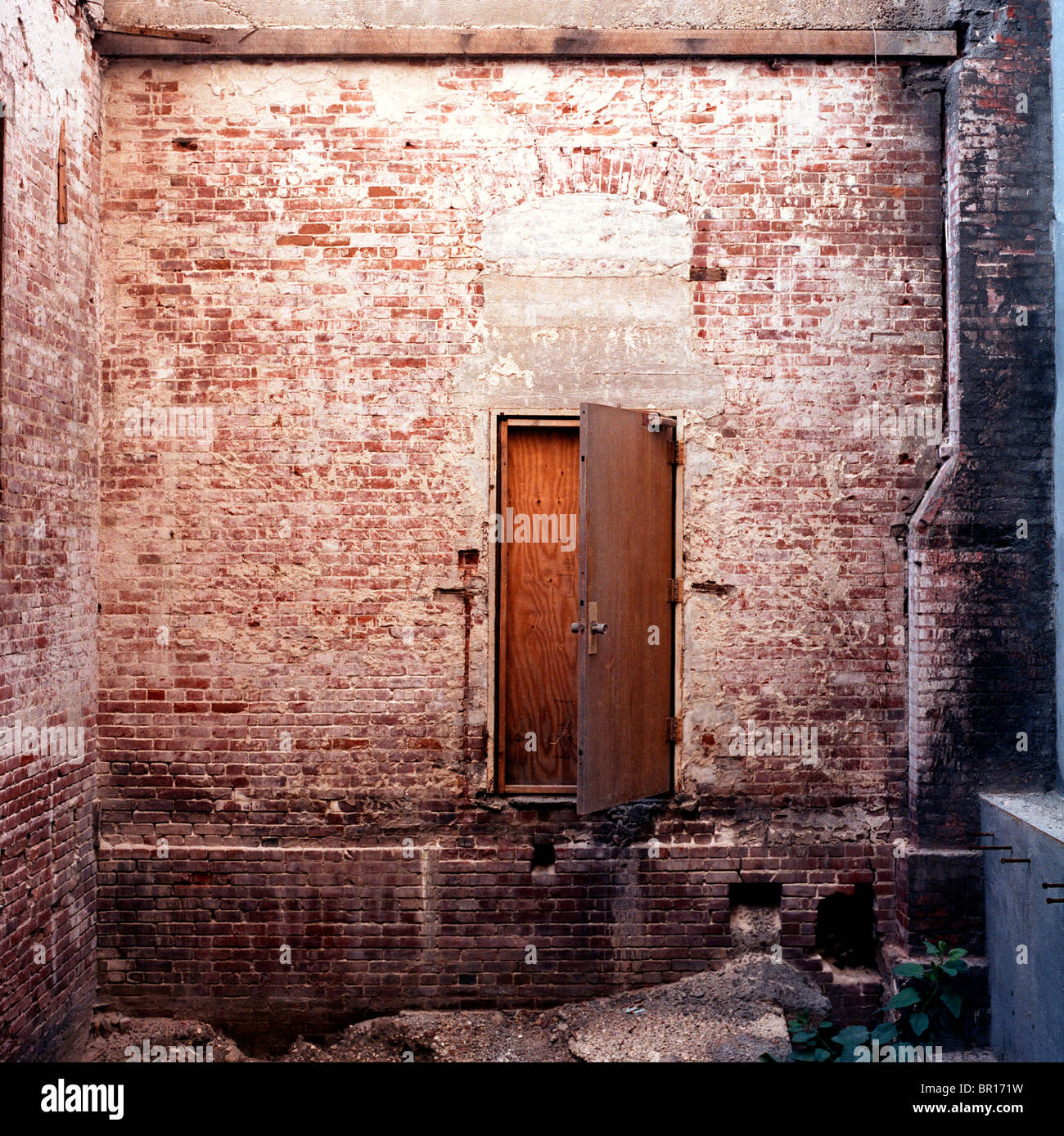 Door in brick wall without stairs Stock Photo Alamy