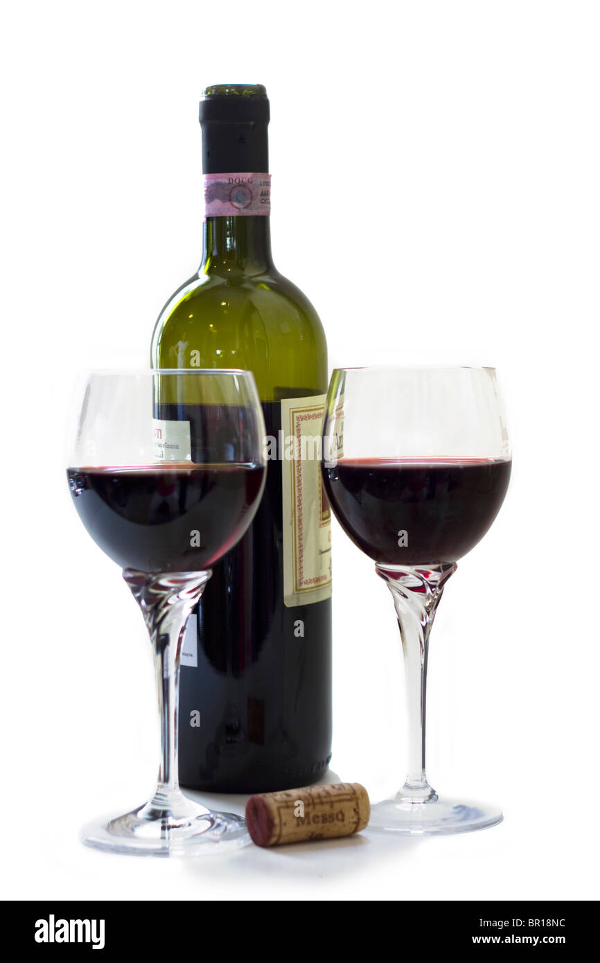 Open bottle with cork and two glasses of red wine Stock Photo