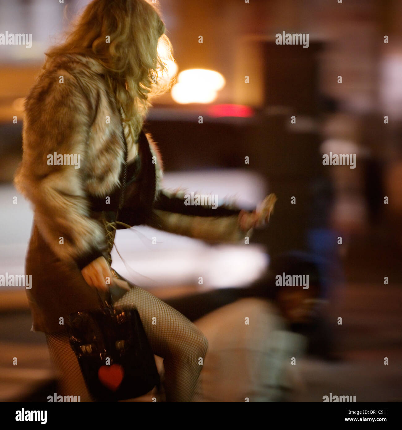 A woman crossing the street Stock Photo - Alamy
