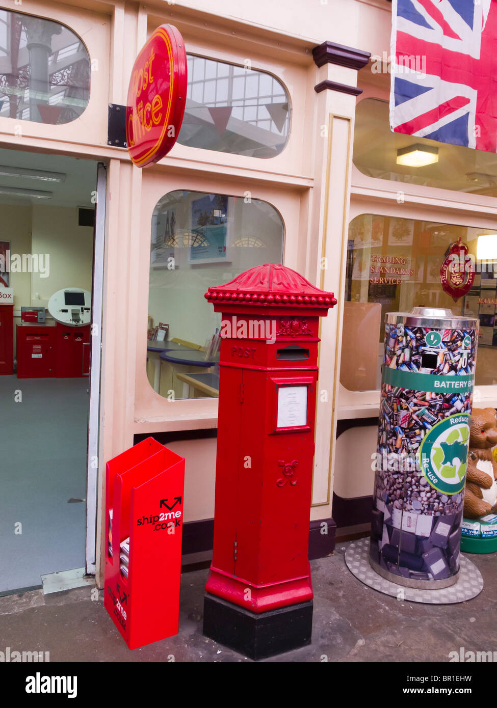 A hexagonal Victorian post box still in use at the Post Office in the covered market in St. Helier, Jersey. Stock Photo