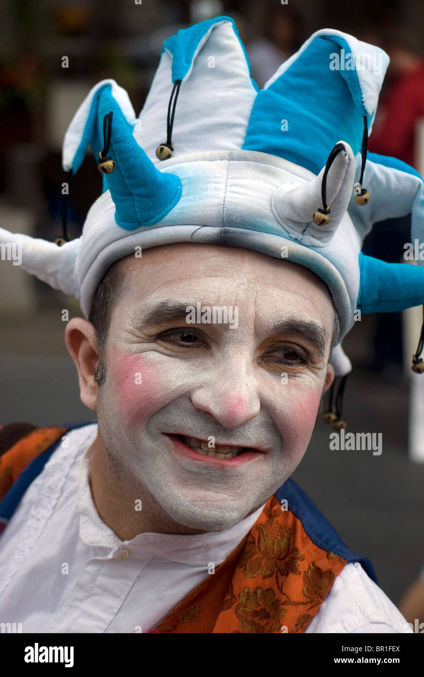 Man dressed as a jester promoting a Fringe show in the Edinburgh Festival, Scotland. Stock Photo