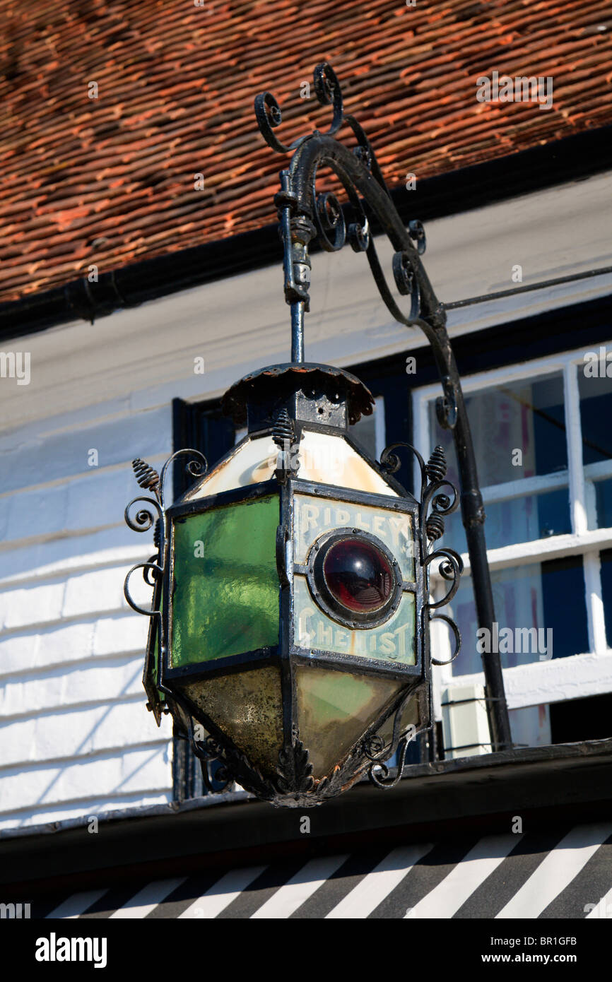 Ornate Lantern on front of 'Paydens Chemist' shop, High Street, Tenterden, Kent, England, UK Stock Photo