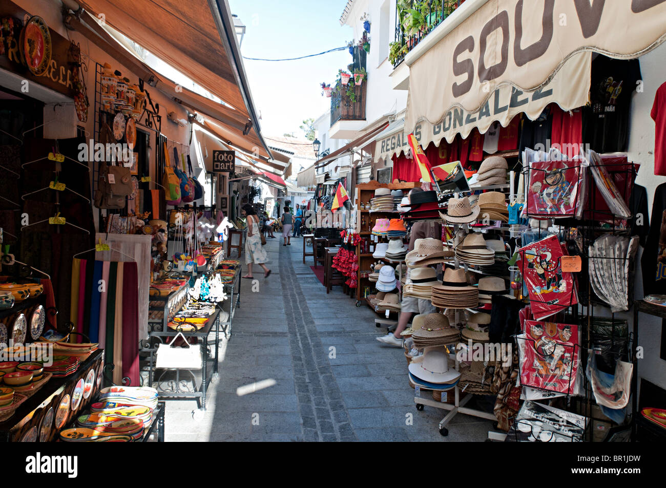 mijas street spain shops with tourist hats gift souvenirs Stock Photo
