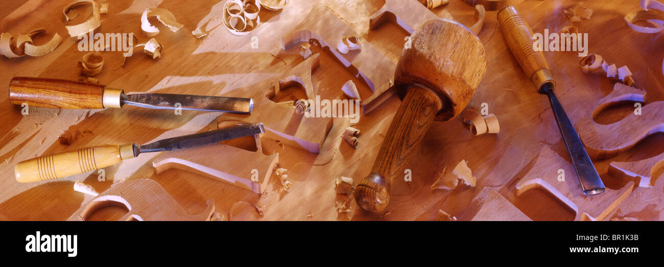 carving letters in wood Stock Photo