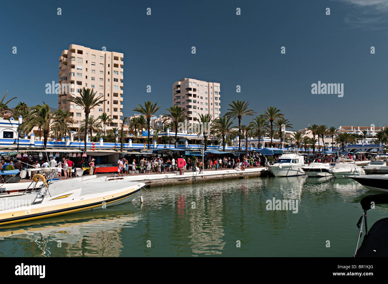estepona harbour with weekly market in the background Stock Photo