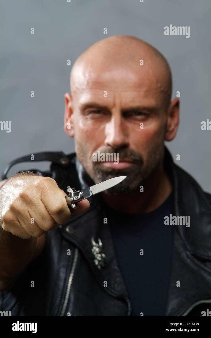 A man with a knife Stock Photo