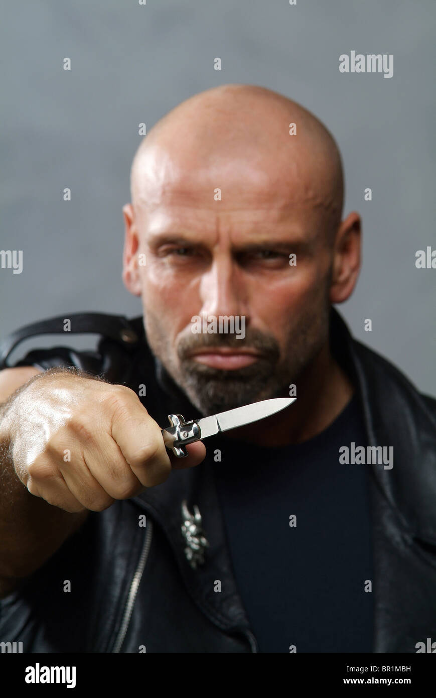 Man holding a knife Stock Photo