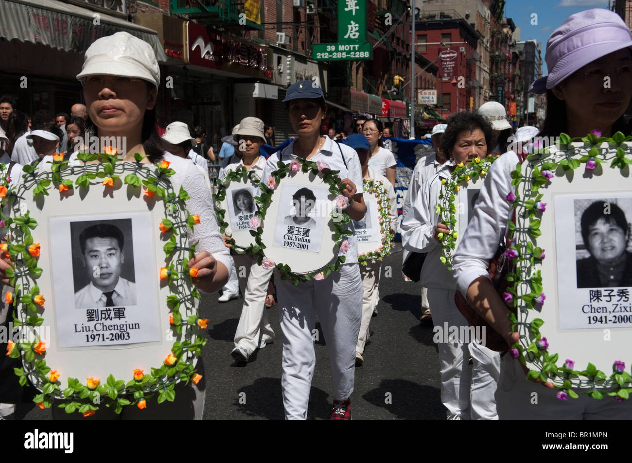 Members of Falun Dafa (Falun Gong) from around the world parade through