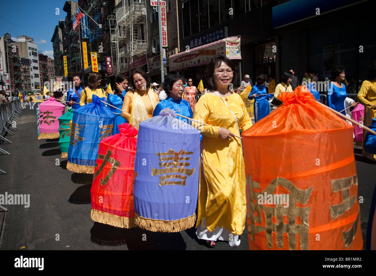 Members of Falun Dafa (Falun Gong) from around the world parade through
