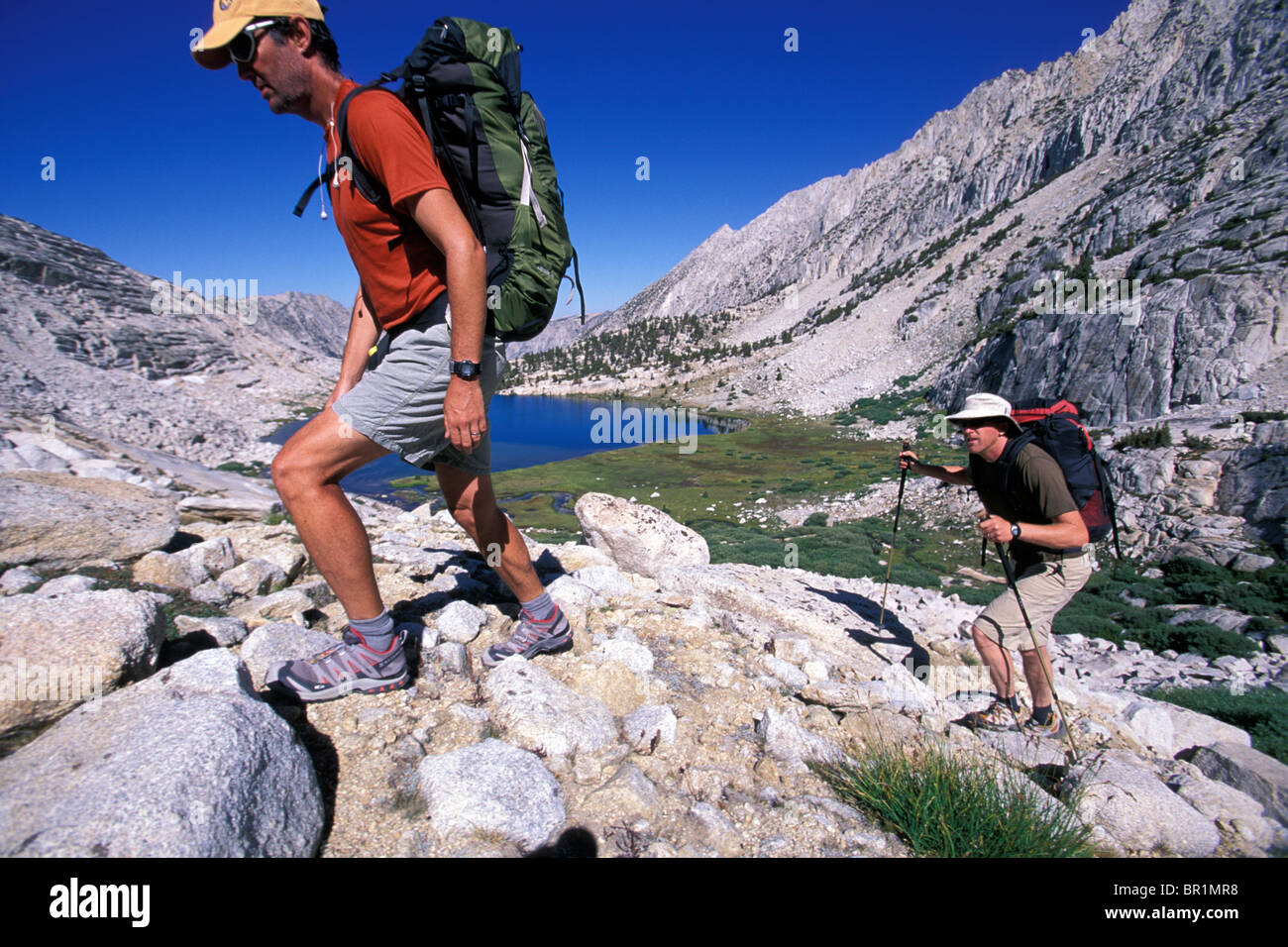 Two men hiking out of a valley in Eastern Sierra Nevada mountains ...