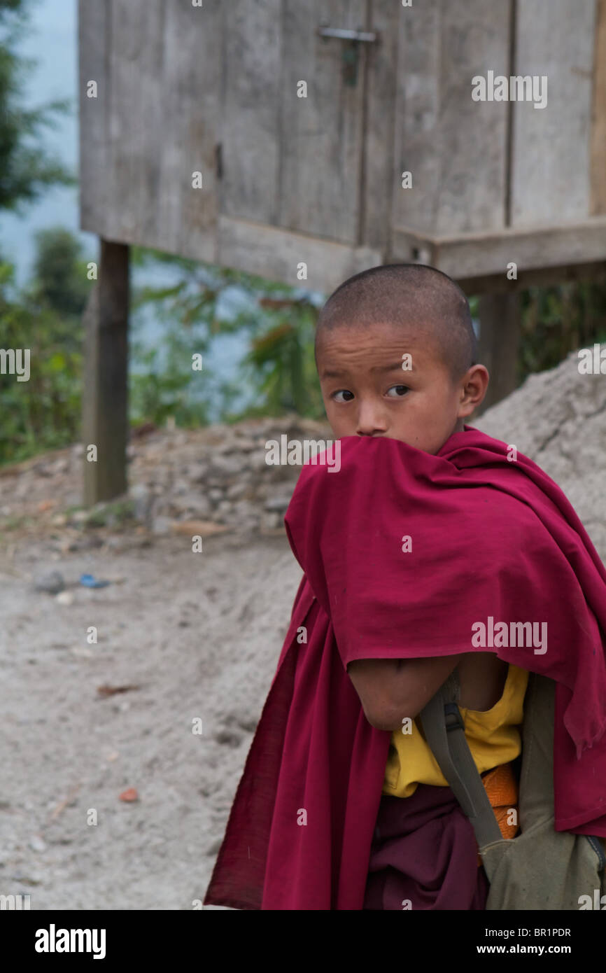 little monk covering his mouth with his dress Stock Photo Alamy