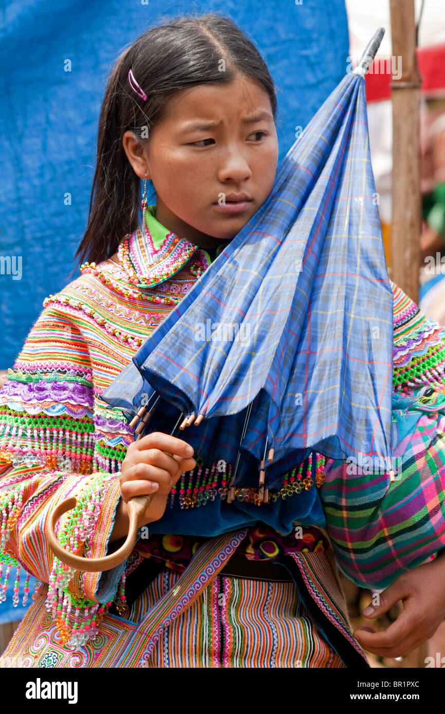 Colourful Flower H'mong tribal girl at Bac Ha Market in North Vietnam. Stock Photo