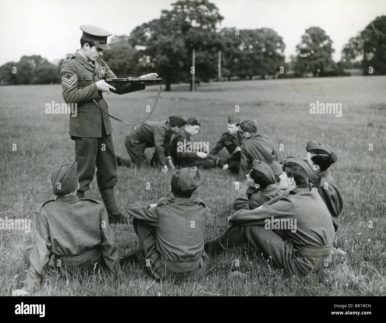 HARROW JUNIOR TRAINING CORPS Public schoolboys receiving basic military