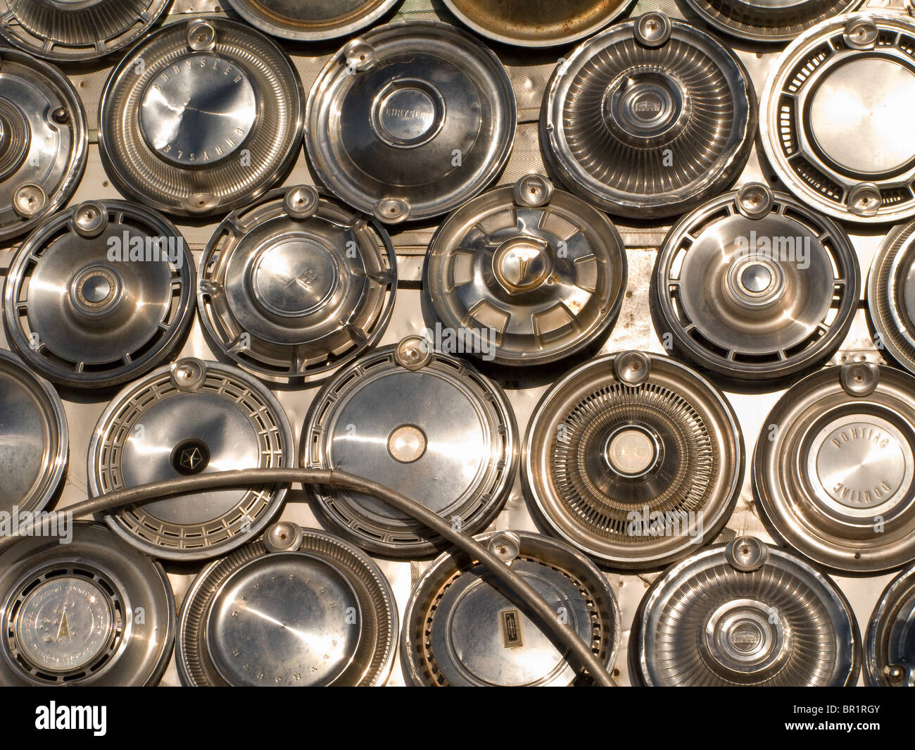 Hubcaps & metal 'folk art' Stock Photo