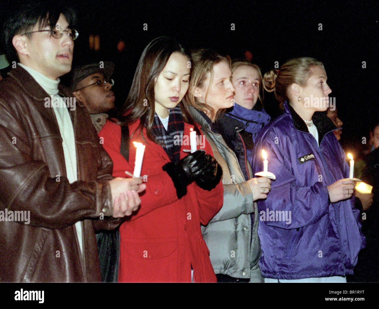 Yale students gather for a candlelight vigil in honor of the slain student at the Sterling Memorial Library on Yale campus. Stock Photo