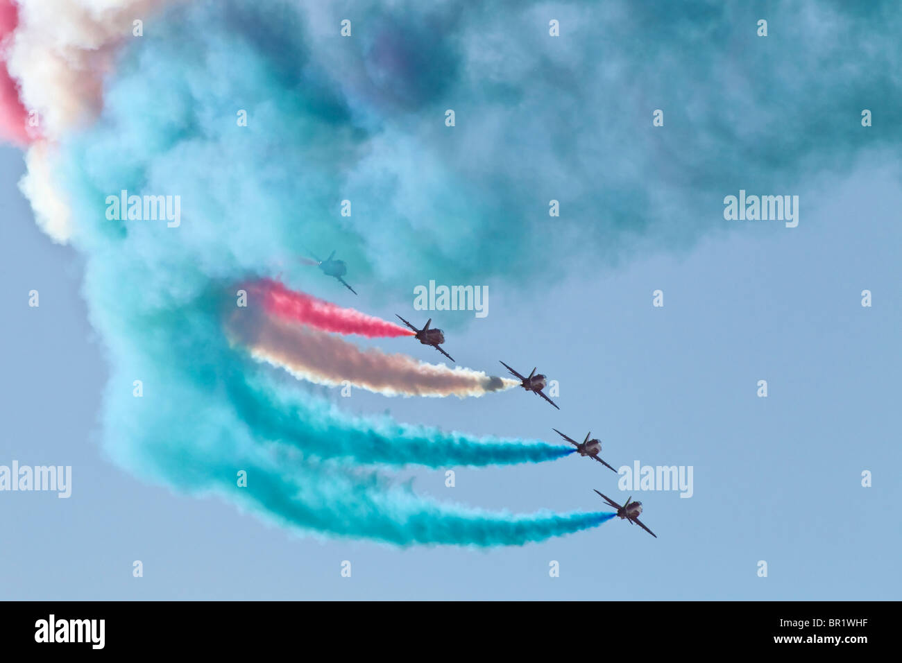 Display smoke from the RAF's Red Arrows formation aerobatic team Stock Photo