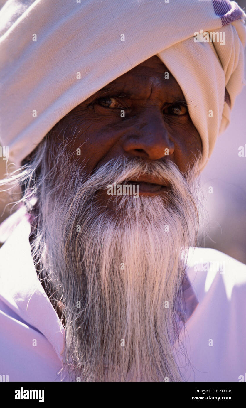 Headshot / portrait of a male villager wearing traditional clothing in