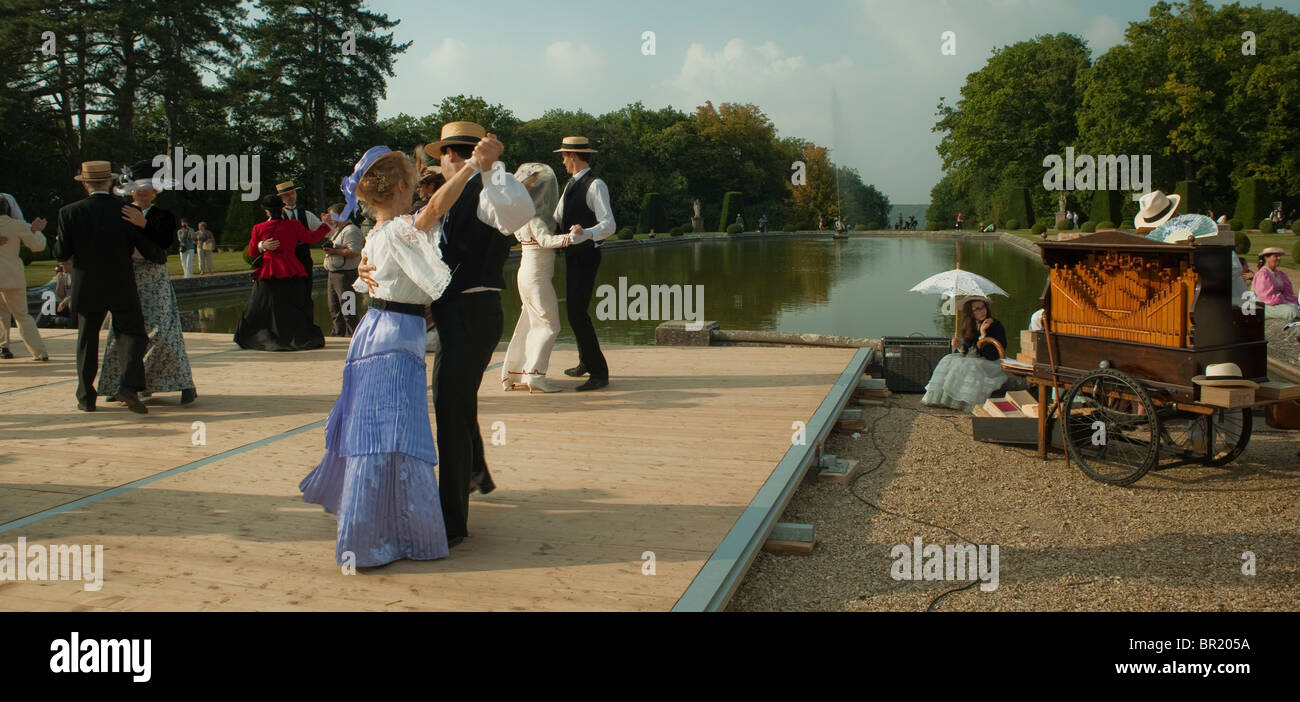 France - senior people activities, French Adults Couples at Traditional Dance, 'Chateau de Breteuil', Choisel,  Dressed in Period Costume, Fancy Vintage Dress, group dancing outdoors people, seniors grown ups, historic holidays Stock Photo