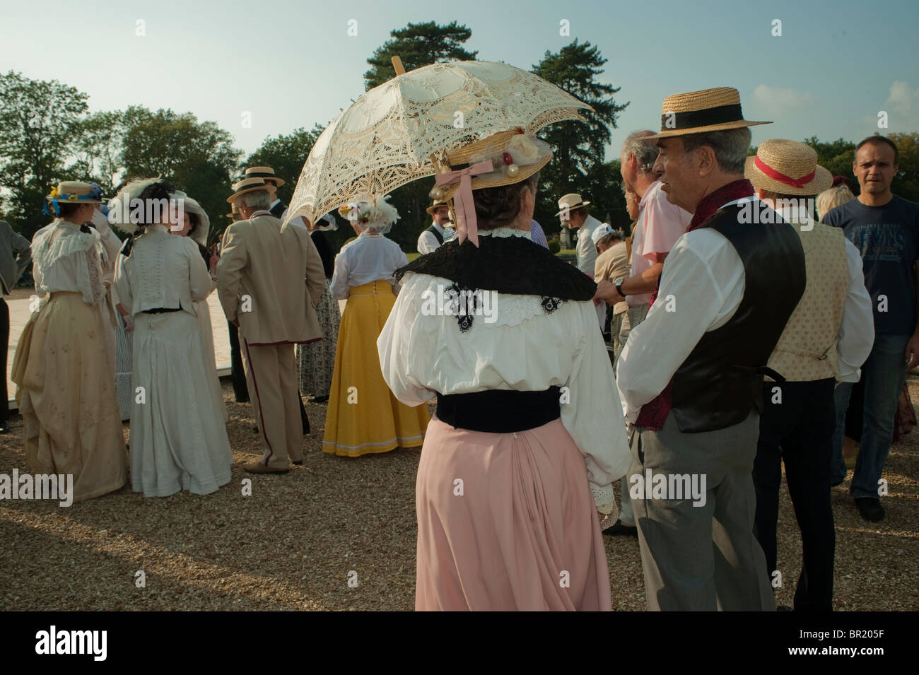 France - Large Crowd of People, Senior Adults Standing outside, Rear, at Traditional Dance, Chateau de Breteuil, Choisel, Families Dressed in Period Costumes, Fancy Dress, Couples, elderly people, vintage dress, Retro bal france Stock Photo