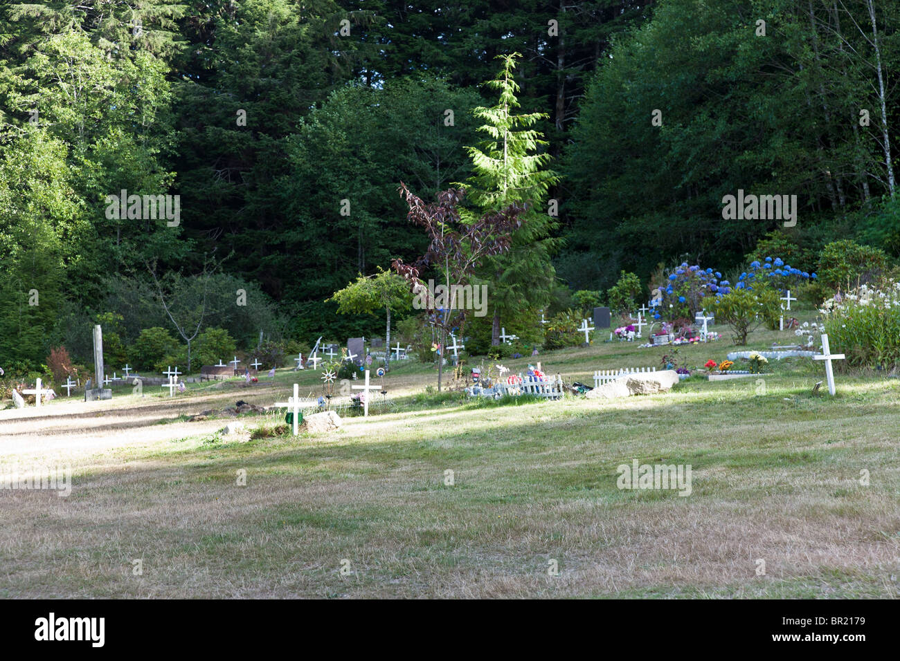 simple white wooden crosses mark Native American graves in Makah Indian cemetary near Neah Bay Olympic Peninsula Washington Stock Photo