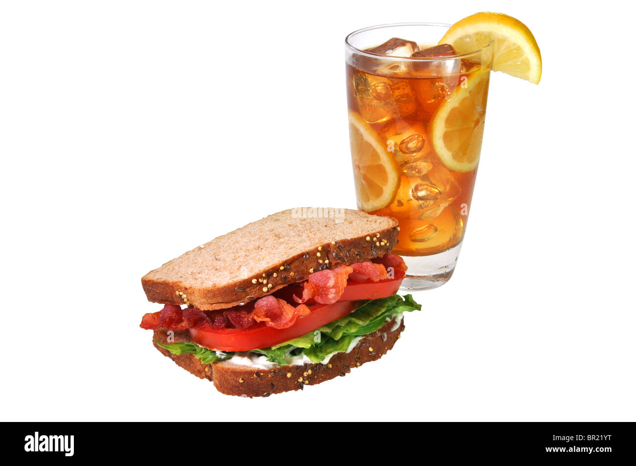 Bacon, lettuce, and tomato sandwich with iced tea with lemons. Isolated