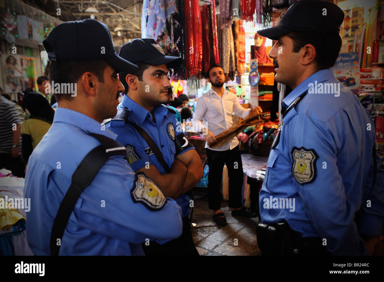 Kurdish policemen chatting in Qaysari bazaar in the city of Erbil also spelled Arbil or Irbil the capital city of Kurdistan Region in northern Iraq. Stock Photo