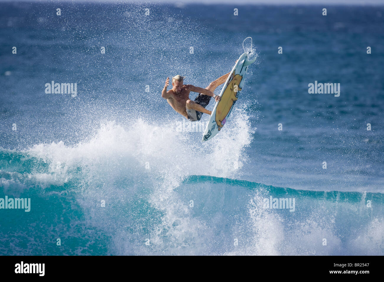 surfer performing an ariel manoeuvre, Hawaii Stock Photo