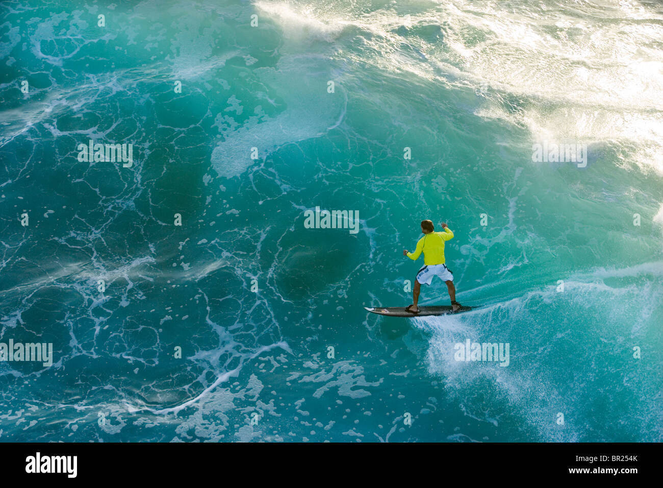 man tow-surfing on the north shore of Oahu, Hawaii Stock Photo
