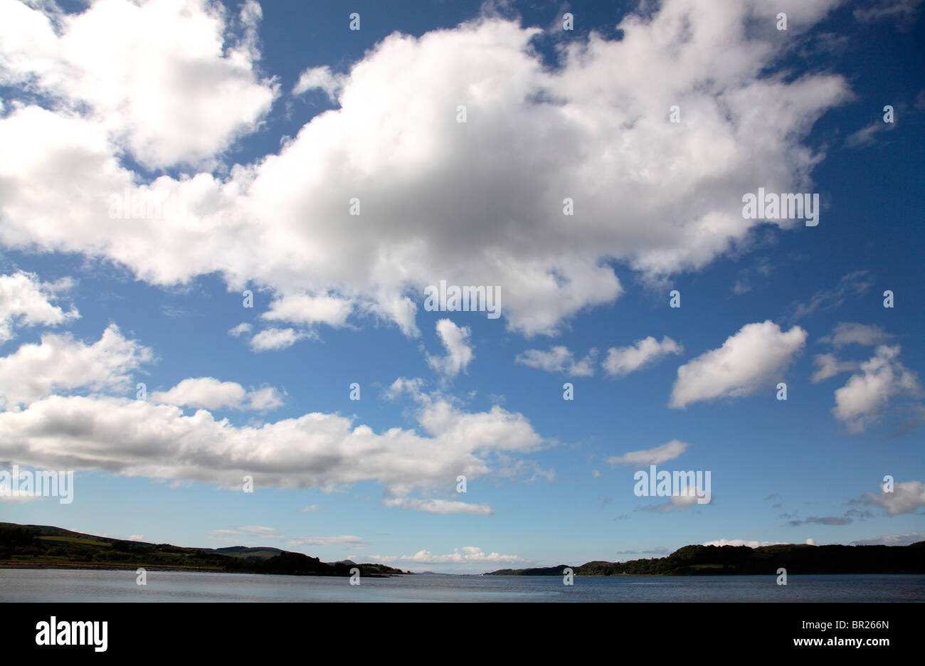 Scottish sky with white fluffy clouds Stock Photo
