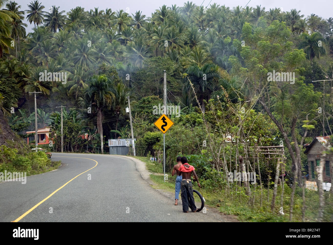 Children play by the road in the Dominican Republic Stock Photo